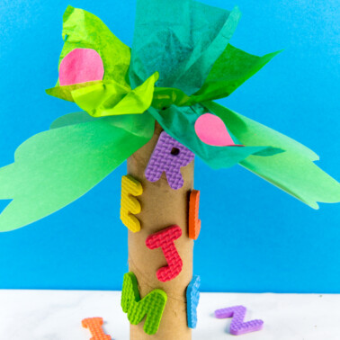 chicka chicka boom boom tree craft for preschoolers using a paper roll, tissue paper, and foam letters