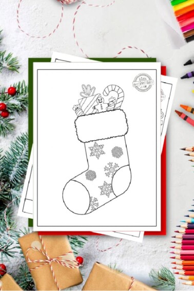 Free Printable Christmas Stocking Coloring Pages - Stocking has snowflakes on it and is filled with a candy cane, a present, a gingerbread man cookie, and candy - Kids Activities Blog