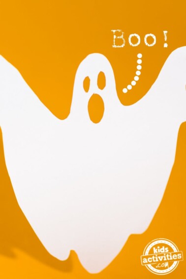 How to keep kids from being scared of Halloween - white ghost on yellow background with boo