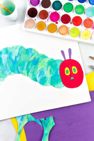 Mixed media watercolor and construction paper very hungry caterpillar craft.