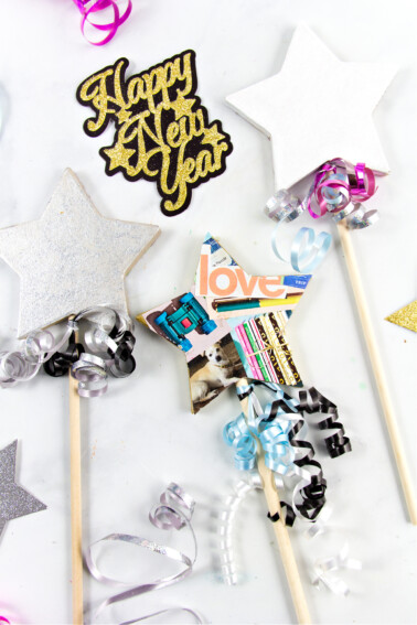 A New Years Eve wishing wand craft made out of a paper mache star, wood dowel and cut up magazines
