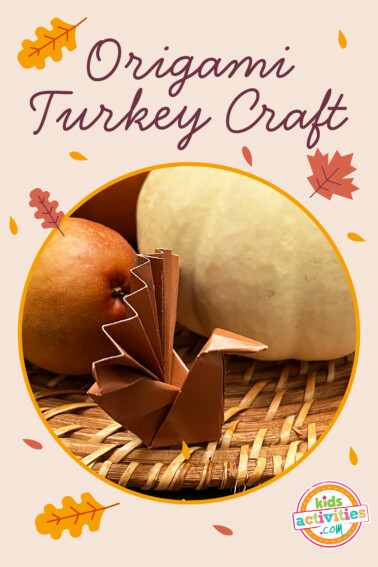image shows a finished origami turkey craft with fall decorations. From Kids Activities Blog
