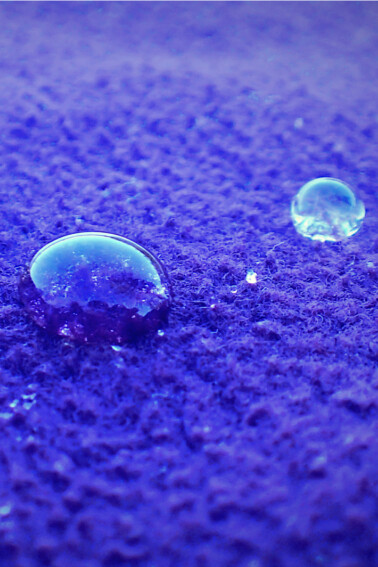 What-is-surface-tension-two-water-droplets-on-purple-surface-Kids-Activities-Blog