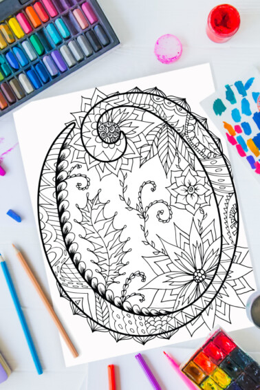 Zentangle alphabet coloring pages - letter o zentangle design on background of paint, colored pencils and art supplies