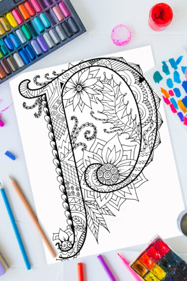 Zentangle alphabet coloring pages - letter p zentangle design on background of paint, colored pencils and art supplies
