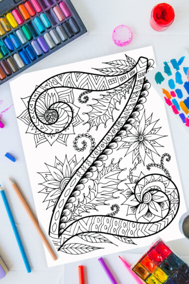 Zentangle alphabet coloring pages - letter z zentangle design on background of paint, colored pencils and art supplies