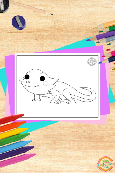 Bearded dragon coloring page for kids on a decorated wooden background with coloring supplies and colorful accessories-kids activities blog