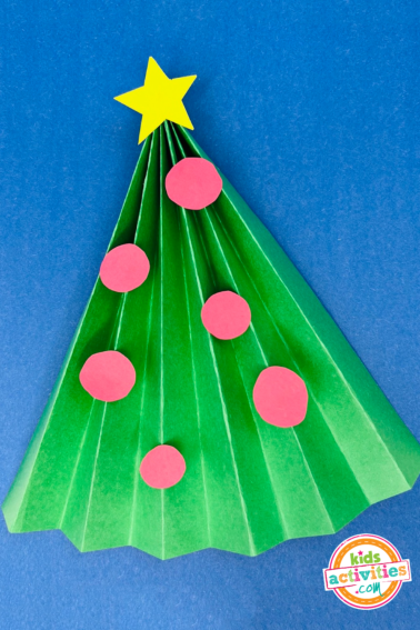 Image shows a Christmas easy craft that looks like a Christmas tree. Kids Activities Blog
