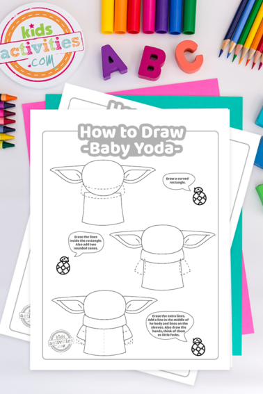 second page of the three page how to draw baby yoda tutorial worksheets on a light surface surrounded by colorful crayons, ABC and the kids activities blog logo