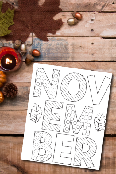 November coloring sheet against a wooden background